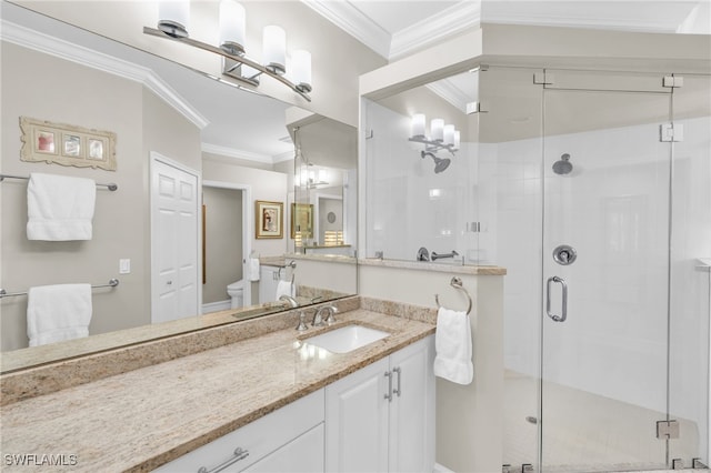 bathroom featuring vanity, an enclosed shower, toilet, and crown molding