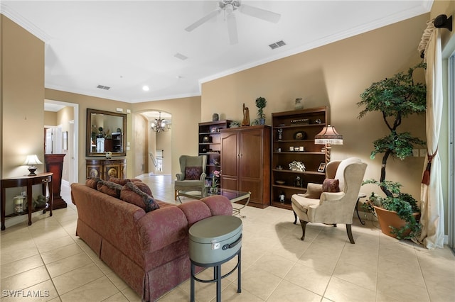 living room featuring light tile patterned flooring, crown molding, and ceiling fan with notable chandelier