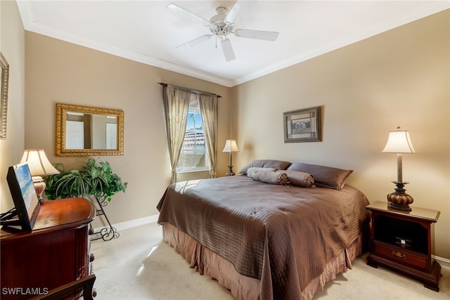 carpeted bedroom with ceiling fan and crown molding