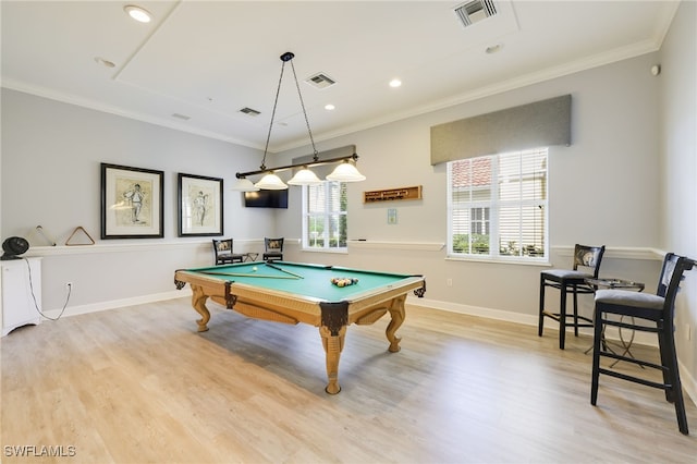 game room with billiards, light wood-type flooring, and crown molding