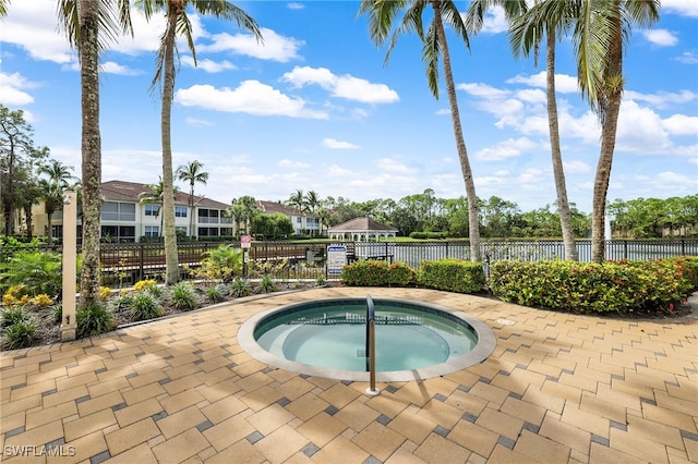 view of pool with a community hot tub