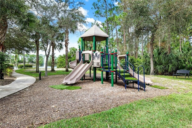 view of jungle gym featuring a lawn