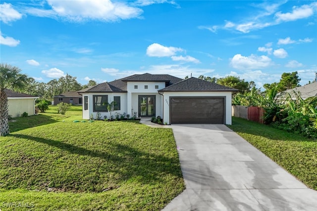 view of front facade featuring a front lawn and a garage