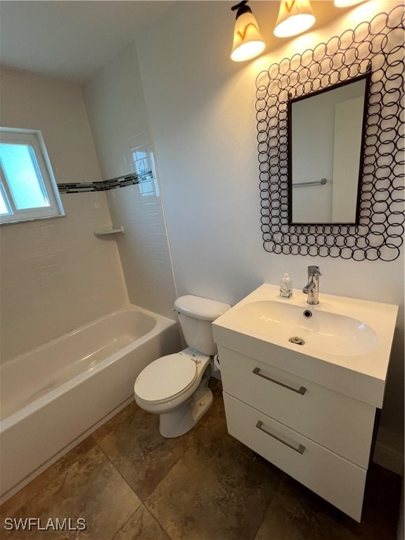 full bathroom with vanity, toilet, and tiled shower / bath