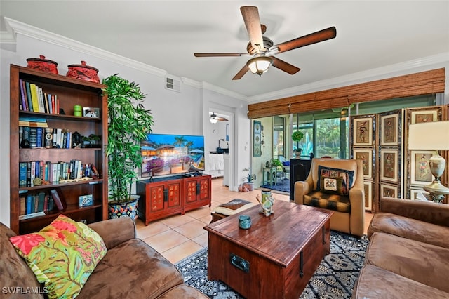 living room with crown molding, light tile patterned floors, and ceiling fan