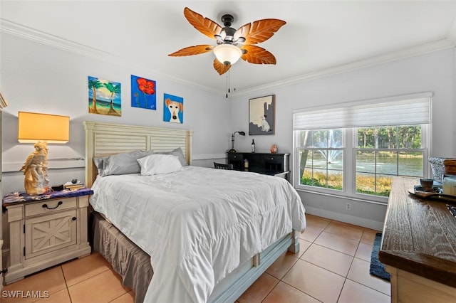 tiled bedroom with ornamental molding and ceiling fan