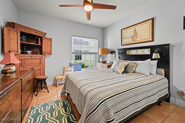 bedroom featuring ceiling fan and light tile patterned flooring