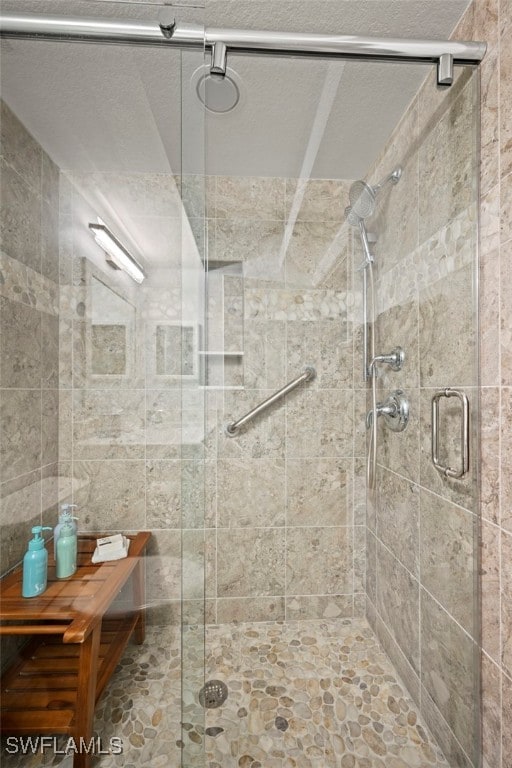 bathroom with a shower with shower door