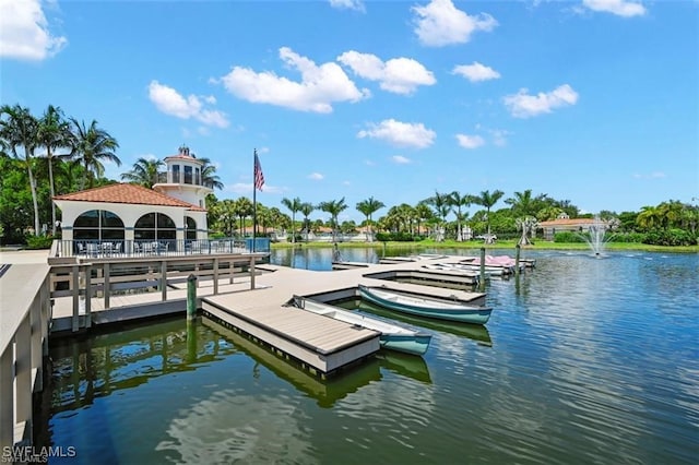 view of dock featuring a gazebo and a water view