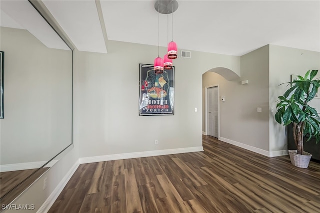 empty room with dark hardwood / wood-style floors