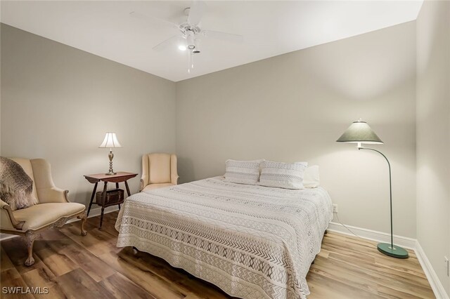 bedroom featuring ceiling fan and wood-type flooring