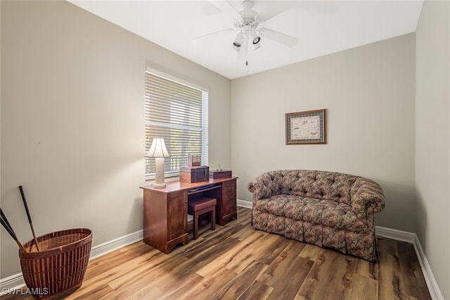 office area with wood-type flooring and ceiling fan