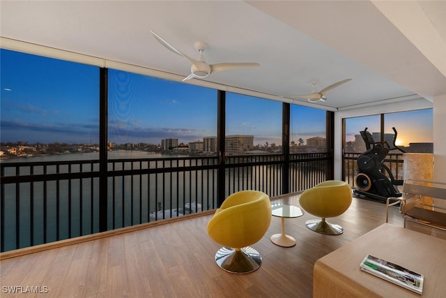 sunroom / solarium featuring ceiling fan