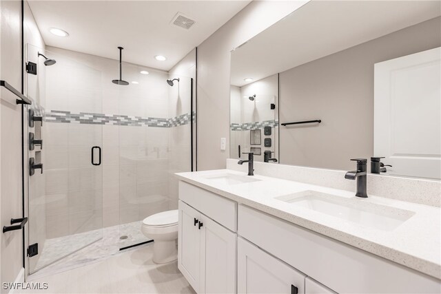 full bath with visible vents, a sink, and a shower stall