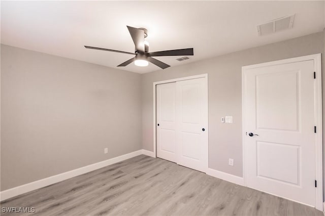 unfurnished bedroom featuring a closet, visible vents, and baseboards