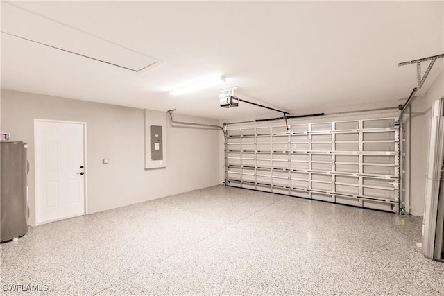 garage with a garage door opener, electric panel, and water heater