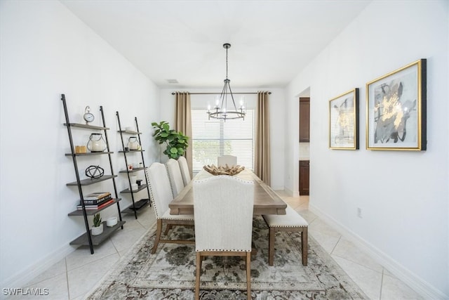 tiled dining area with a notable chandelier