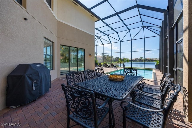 view of patio / terrace featuring area for grilling and a lanai