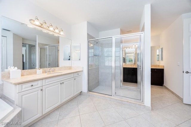 bathroom featuring vanity, separate shower and tub, and tile patterned flooring