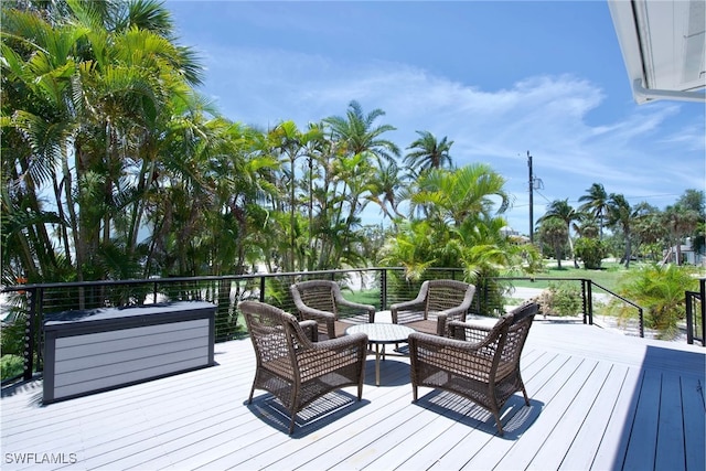 wooden terrace with outdoor lounge area