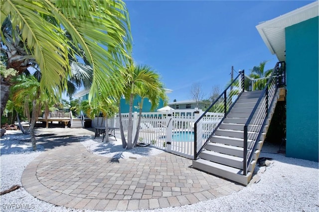 exterior space with a fenced in pool