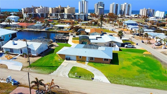 aerial view with a view of city and a water view