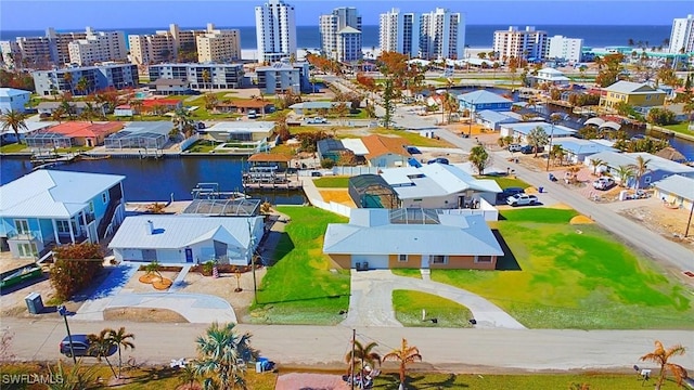 aerial view featuring a water view and a city view