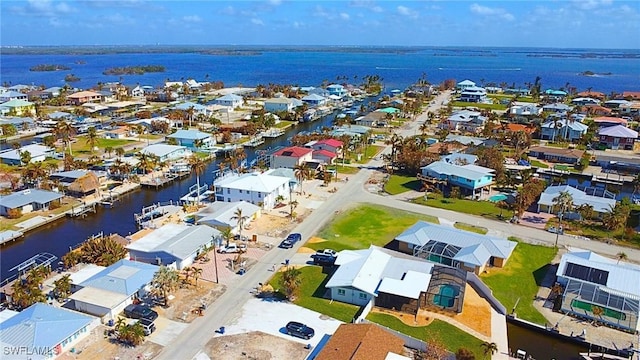 bird's eye view featuring a residential view and a water view