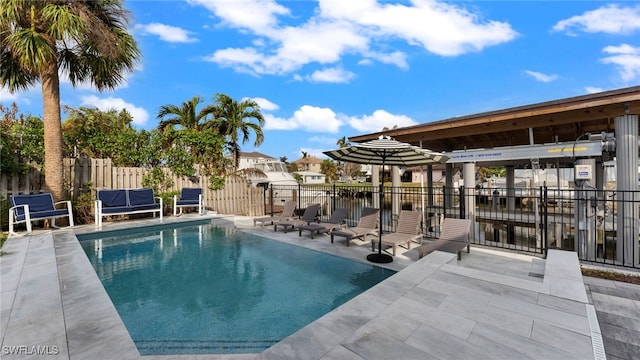 view of swimming pool featuring a patio area