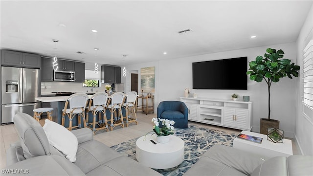 living room with light hardwood / wood-style flooring