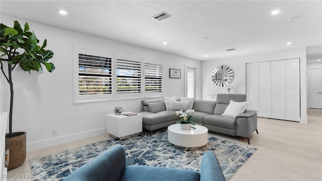 living room with light hardwood / wood-style floors