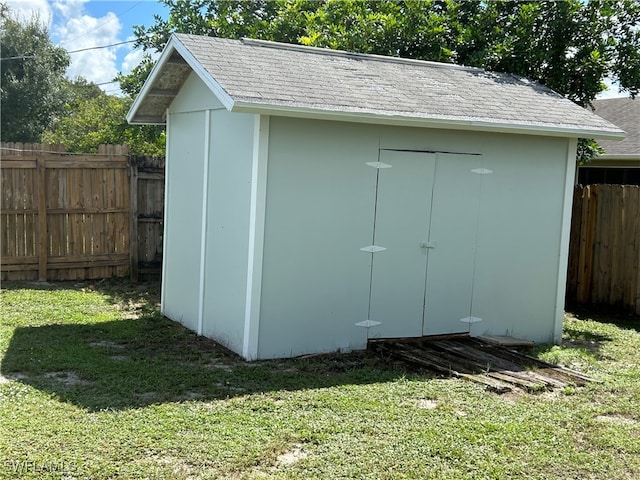 view of outdoor structure featuring a yard