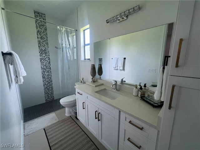 bathroom featuring toilet, a shower with curtain, vanity, and tile patterned flooring