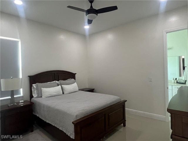 bedroom featuring ensuite bathroom and ceiling fan