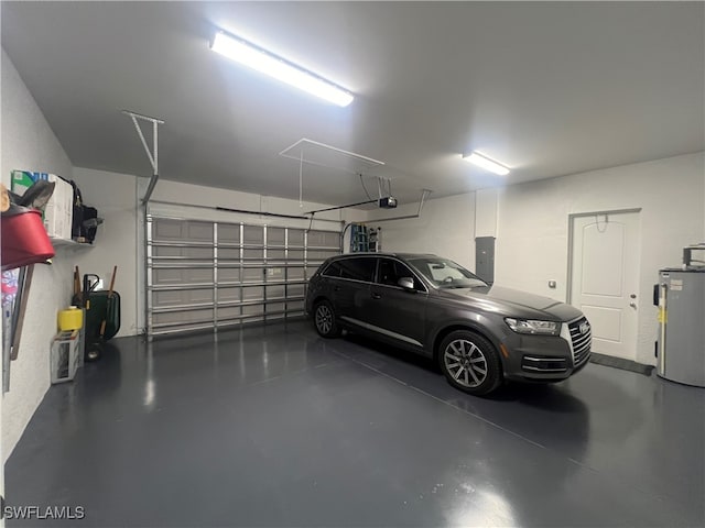 garage featuring a garage door opener, electric panel, and water heater