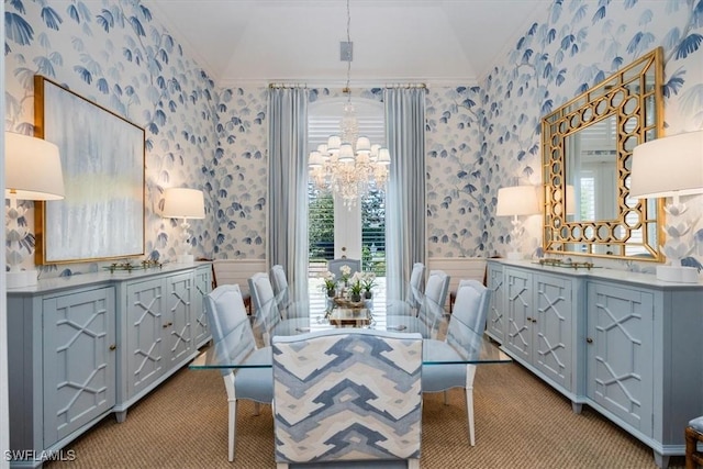 dining area with light colored carpet, vaulted ceiling, and crown molding