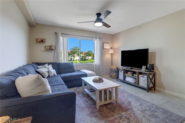 living room with tile patterned floors and ceiling fan