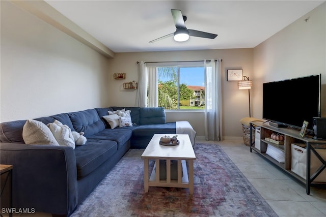 living room with tile patterned floors and ceiling fan