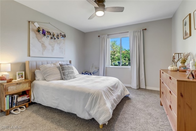 bedroom featuring ceiling fan and light colored carpet