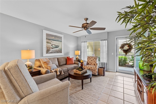 living room with ceiling fan and light tile patterned flooring