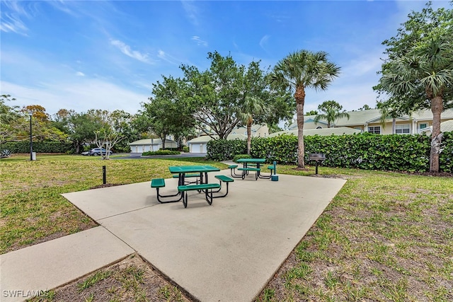 surrounding community featuring a yard and a patio