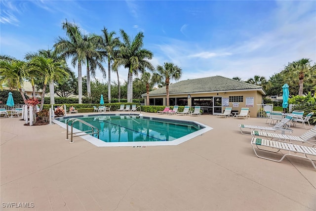 view of swimming pool with a patio area