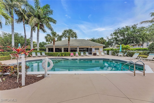 view of swimming pool featuring a patio area