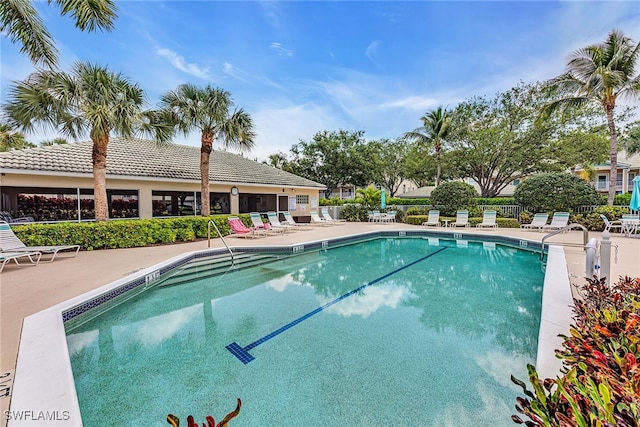 view of swimming pool with a patio area