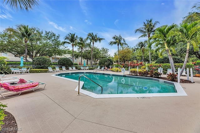 view of swimming pool with a patio