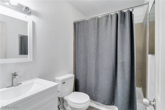 full bathroom with vanity, toilet, and shower / tub combo