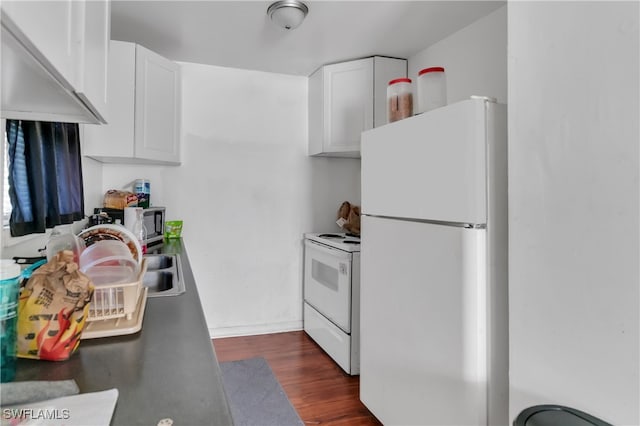 kitchen with white cabinetry, dark wood-type flooring, and white appliances