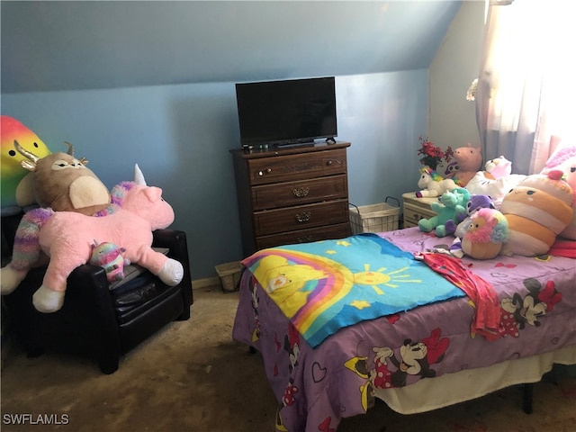 bedroom featuring lofted ceiling and carpet floors