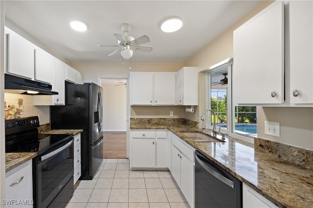 kitchen with dark stone countertops, sink, stainless steel dishwasher, black electric range, and white cabinets