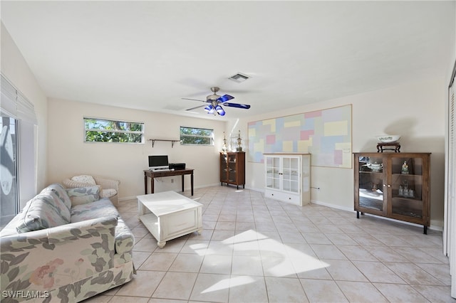 tiled living room with ceiling fan